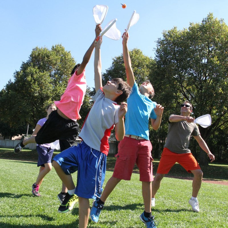 A fun outdoor catch game featuring two rackets and balls, designed for players of all ages to enjoy.