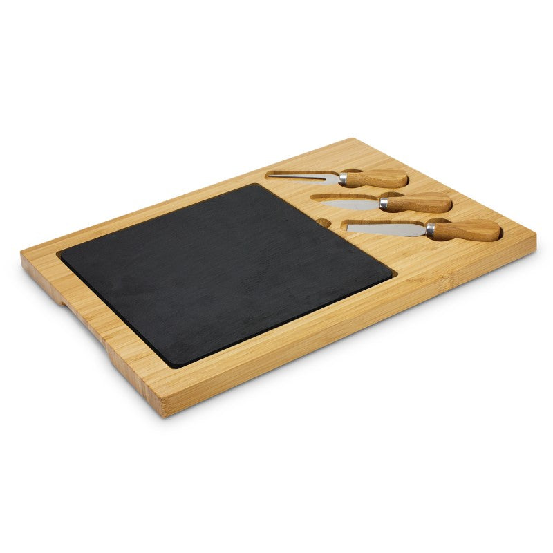 Luxurious slate cheese serving board with knives, fork, and removable insert, ideal for elegant entertaining and gifting.