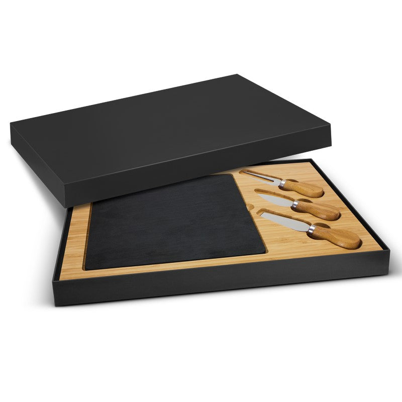 Luxurious slate cheese serving board with removable insert, including cheese knives and fork, beautifully packaged for gifting.