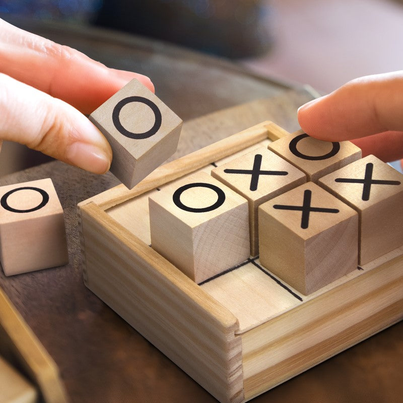 Classic Naughts & Crosses game in a pine wood box, perfect for family fun, travel, or as a gift.