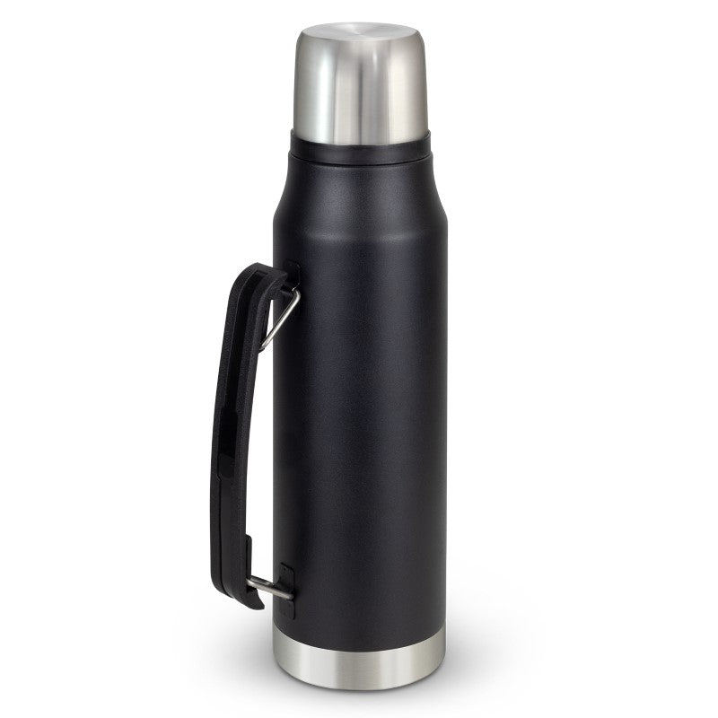 Stainless steel vacuum thermal flask with a cup, designed for outdoor adventures, keeps drinks hot, and features a carrying handle.