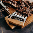 Robust meat shredding claws with Acacia wooden handles and durable stainless steel claws, perfect for effortless meat prep.