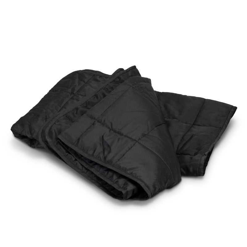 Cozy puffer blanket measuring 1250 x 1500mm, perfect for indoor/outdoor use, packed in a convenient drawstring pouch.