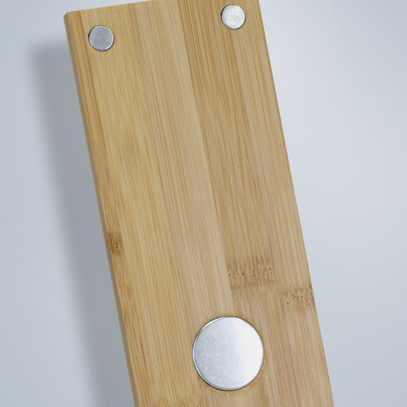 Magnetic fridge bottle opener with cap-catcher, durable iron, and bamboo backing for style and convenience.