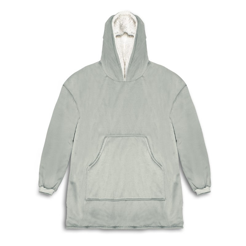 Cozy blanket hoodie with plush sherpa lining, kangaroo pocket, designed for warmth and comfort in any setting.
