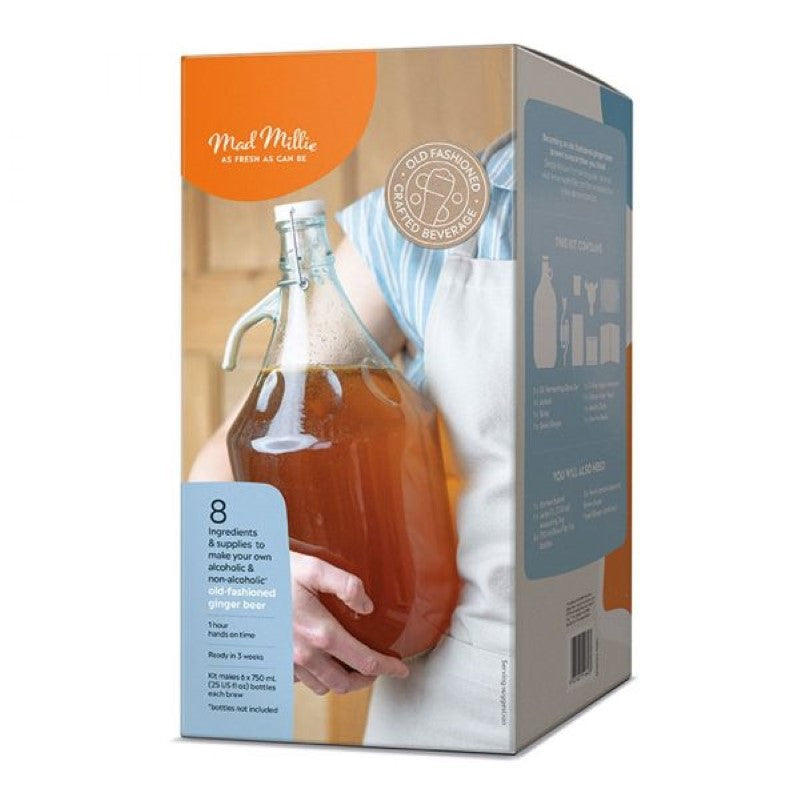 Homemade ginger beer making kit with all ingredients, including a glass jar, yeast, and dried ginger for expert brewers.