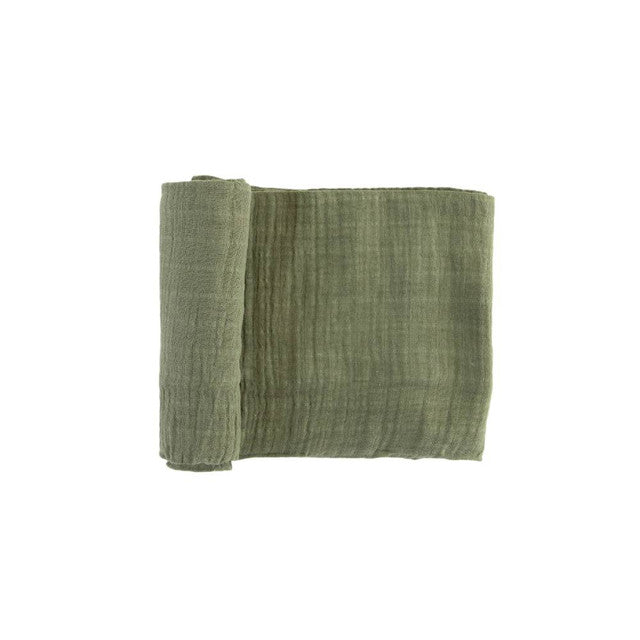 Lightweight cotton muslin swaddle in fern print for infants, ideal for swaddling, nursing, and cuddling.