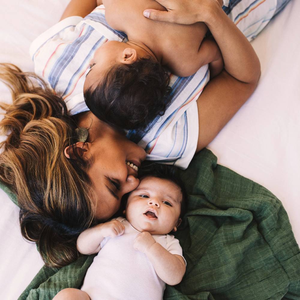 Lightweight cotton muslin swaddle in fern print, perfect for swaddling, nursing, and enhancing baby’s sleep comfort.