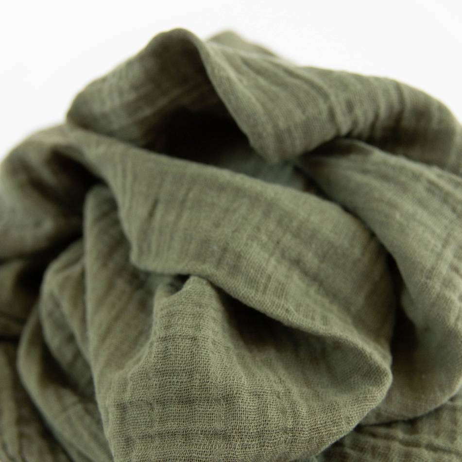 Lightweight fern print cotton muslin swaddle for infants, perfect for secure swaddling and enhancing sleep.