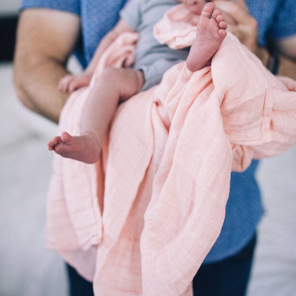 Lightweight 100% cotton muslin swaddle in Rose Petal, 120cm x 120cm, perfect for swaddling infants 0-3 months.