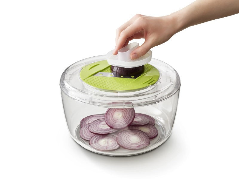 4-in-1 Salad Bowl Set with interchangeable discs for spinning, spiralizing, grating, and slicing, featuring a safe design.