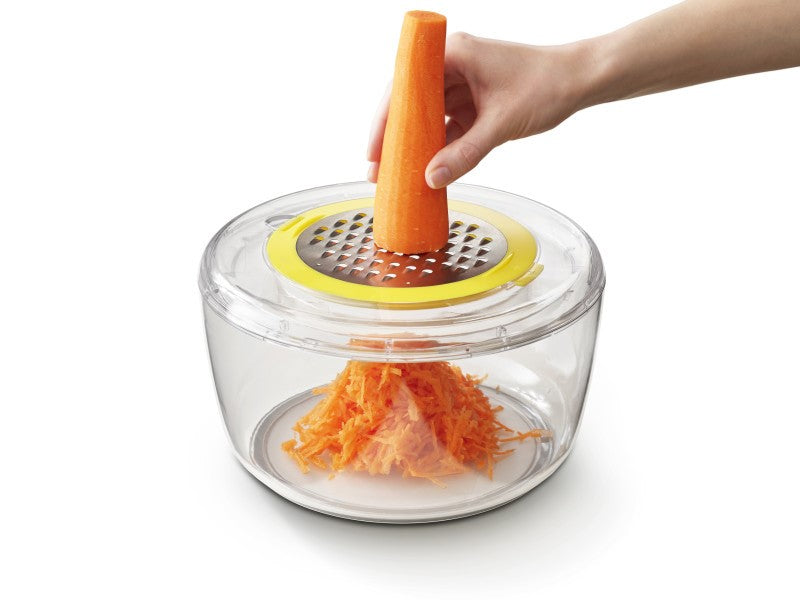 4-in-1 Salad Preparation Kit with interchangeable discs for spinning, spiralizing, grating, and slicing, featuring a non-slip base.