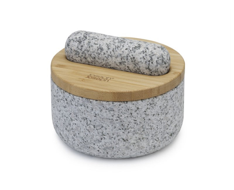 Joseph Joseph Mortar & Pestle in natural granite, features reversible bamboo lid for storage and ingredients preparation.