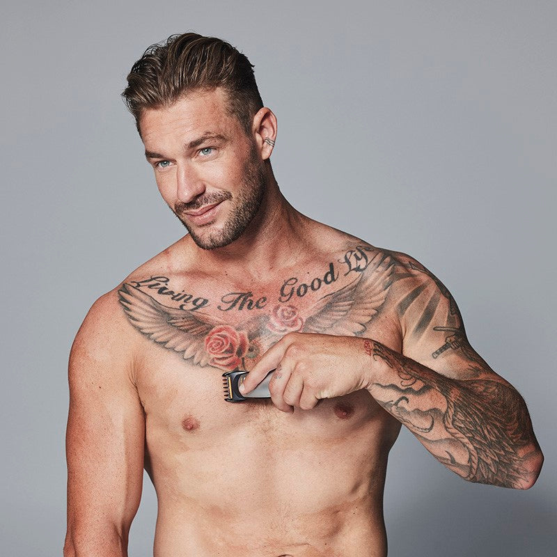 Waterproof multi-purpose trimmer with interchangeable heads for precise grooming of face, body, and hair in the shower.