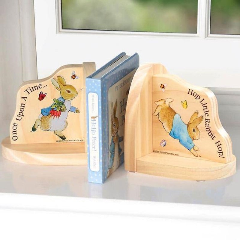 Charming Peter Rabbit wooden bookends with illustrations, perfect for organizing children's books in nursery decor.