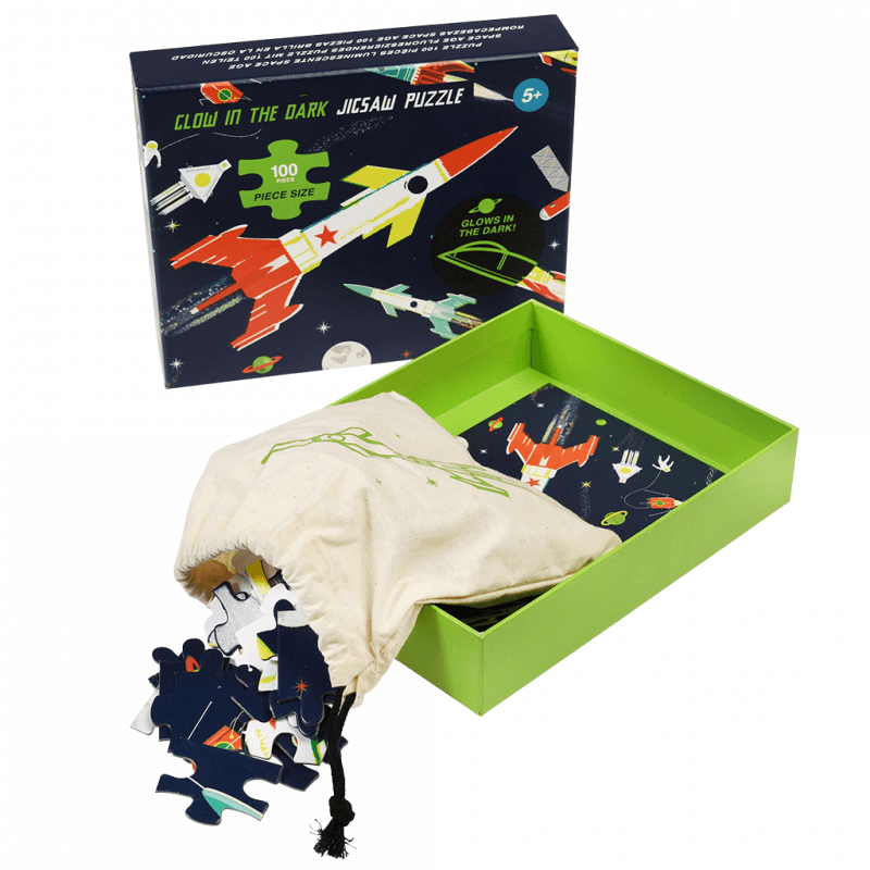 Colorful glow-in-the-dark space puzzle with rockets and planets, perfect for kids aged 5 and up, 100 pieces.