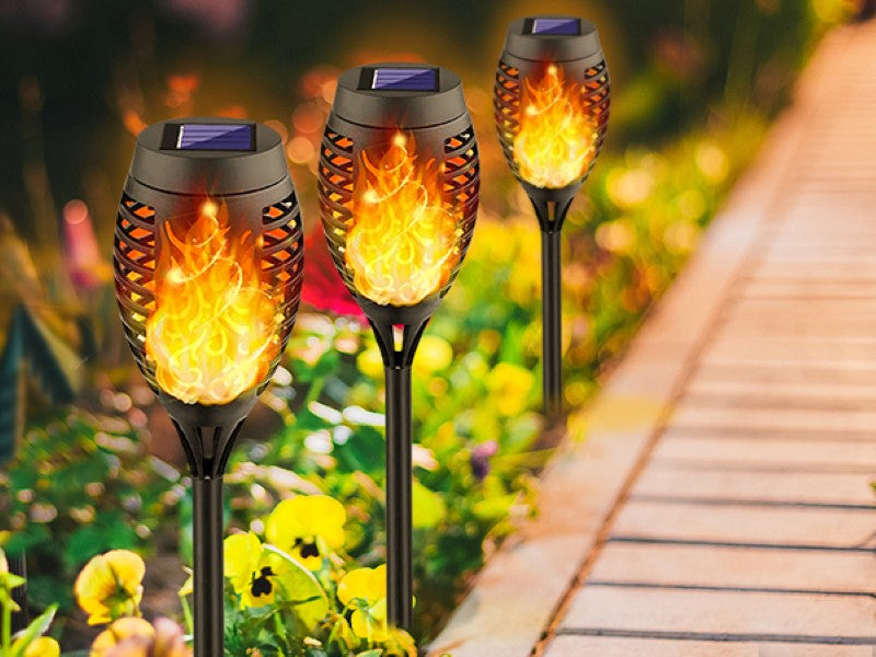 Solar torch lights with flickering flame effect, ideal for outdoor decor and pathways, featuring 96 LED lights and waterproof design.