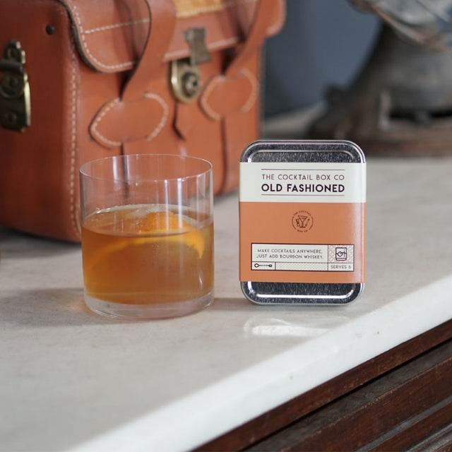 Old Fashioned Cocktail Kit with bitters, raw cane sugar, muddler spoon, picks, and hand-knit napkin for perfect cocktails.