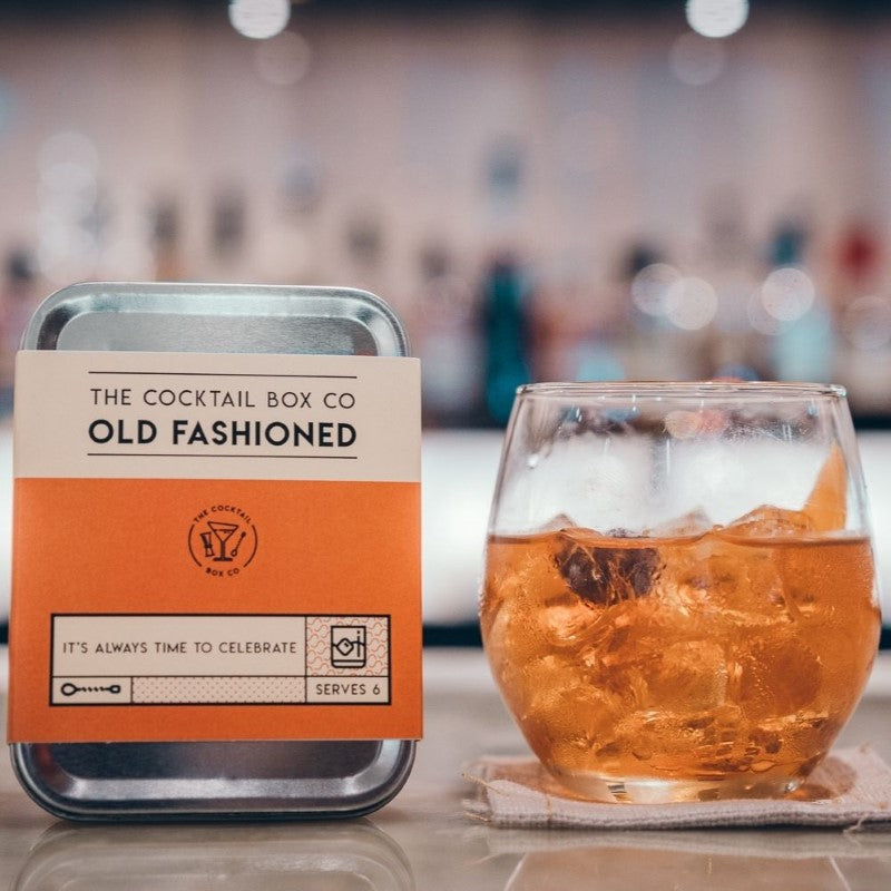 Old Fashioned Cocktail Kit with bitters, sugar, stainless steel tools, muddler, and hand-knit napkin for perfect cocktails anywhere.