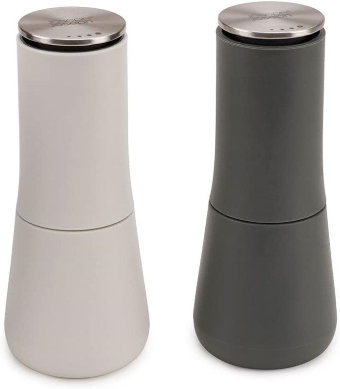 Elegant inverted salt and pepper mills with top grinding mechanism, keeping surfaces mess-free and easy to refill.