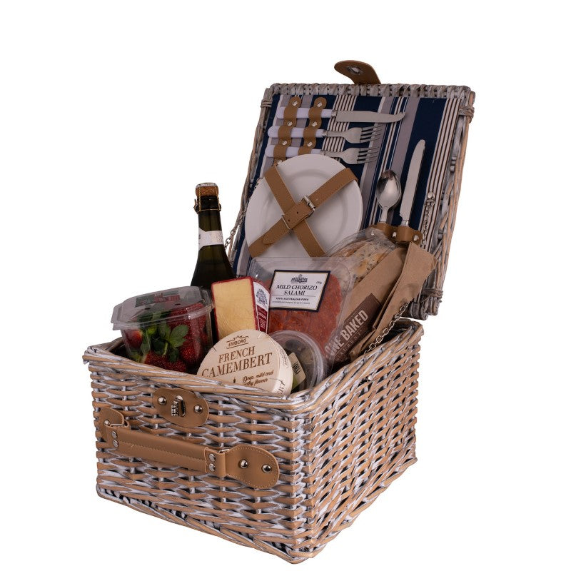 Stylish 2-person picnic basket with Hampton stripe lining, includes cutlery and plates, perfect for outdoor dining adventures.