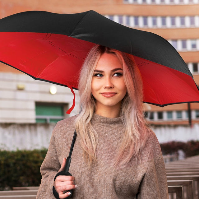 Inverted umbrella with inside-out mechanism, C-shaped handle, and durable canopy for stylish rain protection.