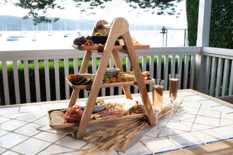 Elegant 3-tiered acacia wood serving ladder for showcasing cheese, charcuterie, and desserts at any event.