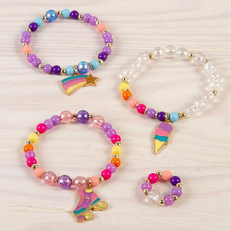Colorful charm bracelet making kit for girls, featuring over 70 beads, 3 charms, and elastic cord for DIY jewelry creation.