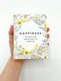 Pocket-sized book 'Happiness' featuring inspiring quotes for daily positivity and personal growth.