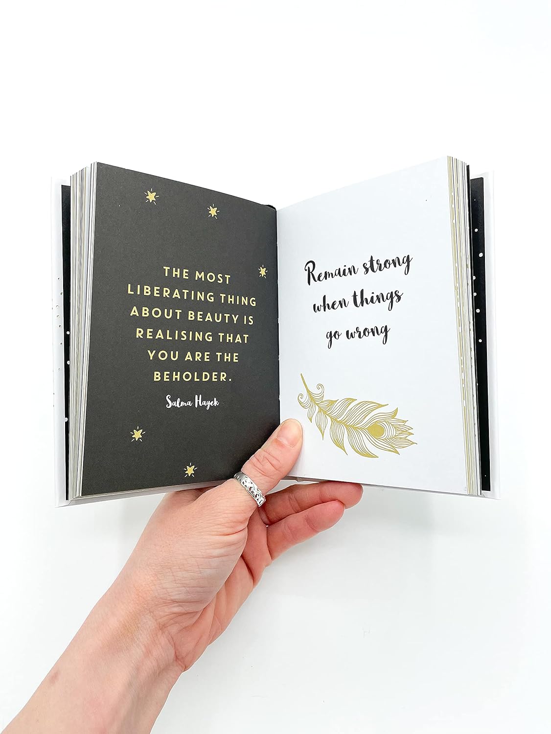 Inspiring book titled "She Believed She Could So She Did," filled with motivational quotes and messages for empowerment.