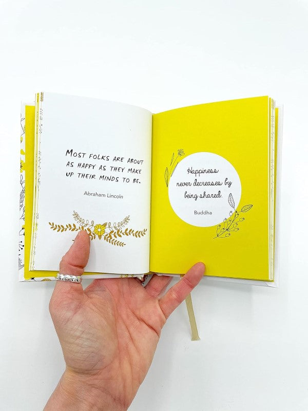 Inspiring pocket-sized book featuring uplifting quotes for daily motivation and positivity from renowned thinkers.