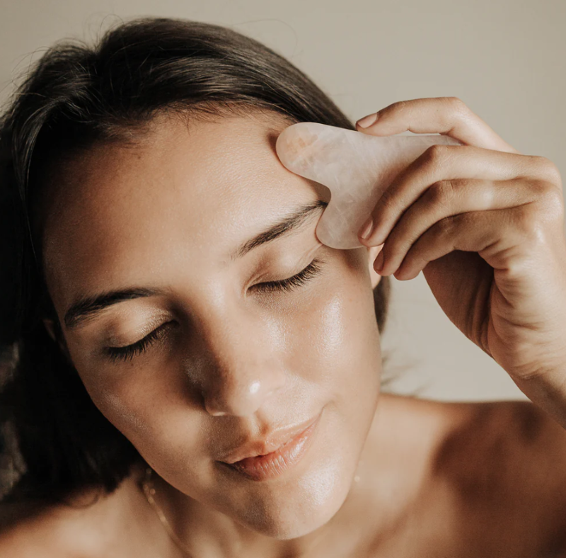 Rose Quartz Gua Sha tool for facial toning, stress relief, and enhanced skincare absorption in elegant gift-ready packaging.