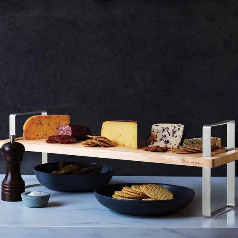 Versatile multi-height serving board with adjustable legs, perfect for elegant food presentations at any occasion.