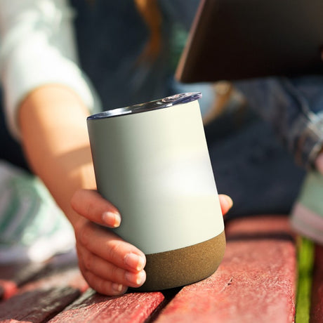Sleek insulated coffee cup with double-wall design, cork base, and push-on lid, perfect for style and practicality.