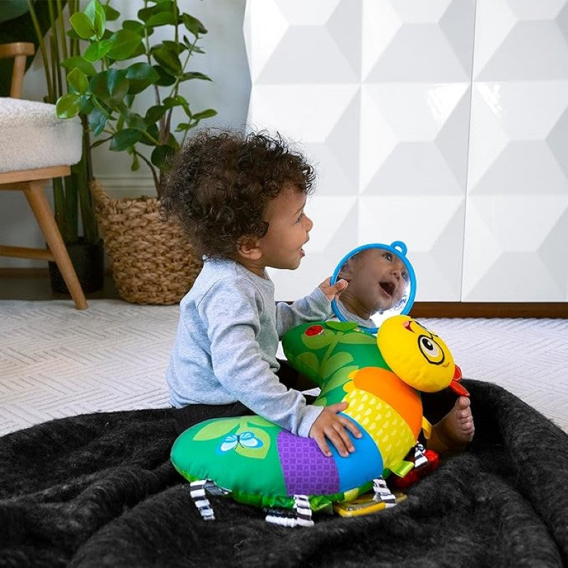 Tummy Time Activity Pillow with 9 sensory elements, including rattles, mirror, and textured rings for baby's development.