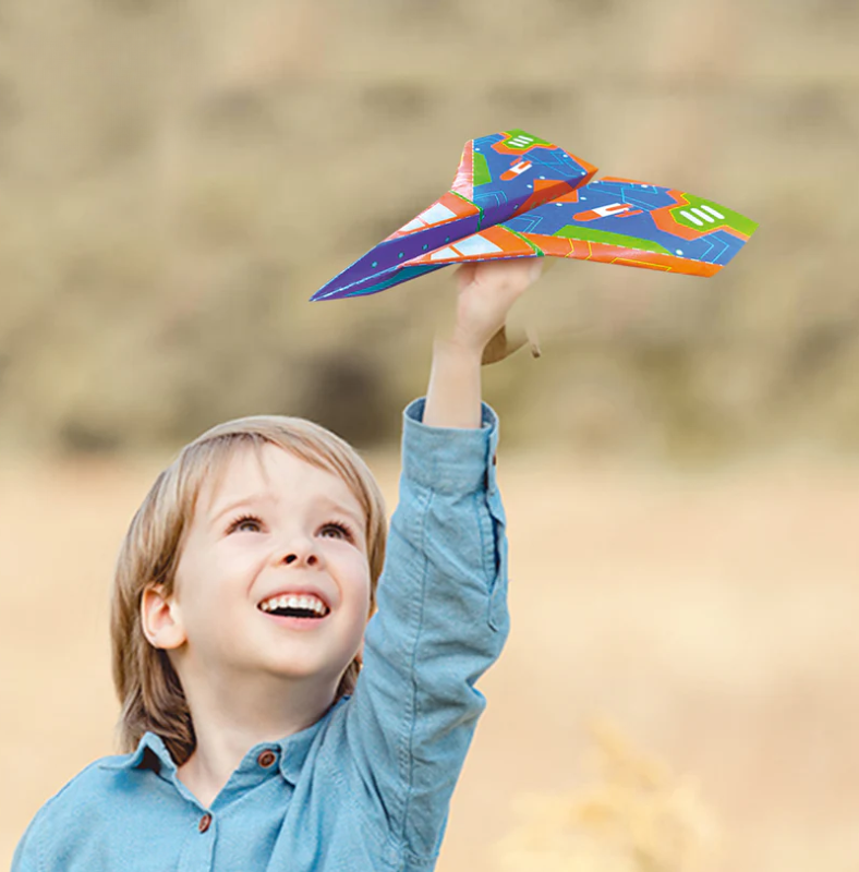 Colorful origami paper airplane kit with foldable sheets, airport poster, and decorative cards for creative play.
