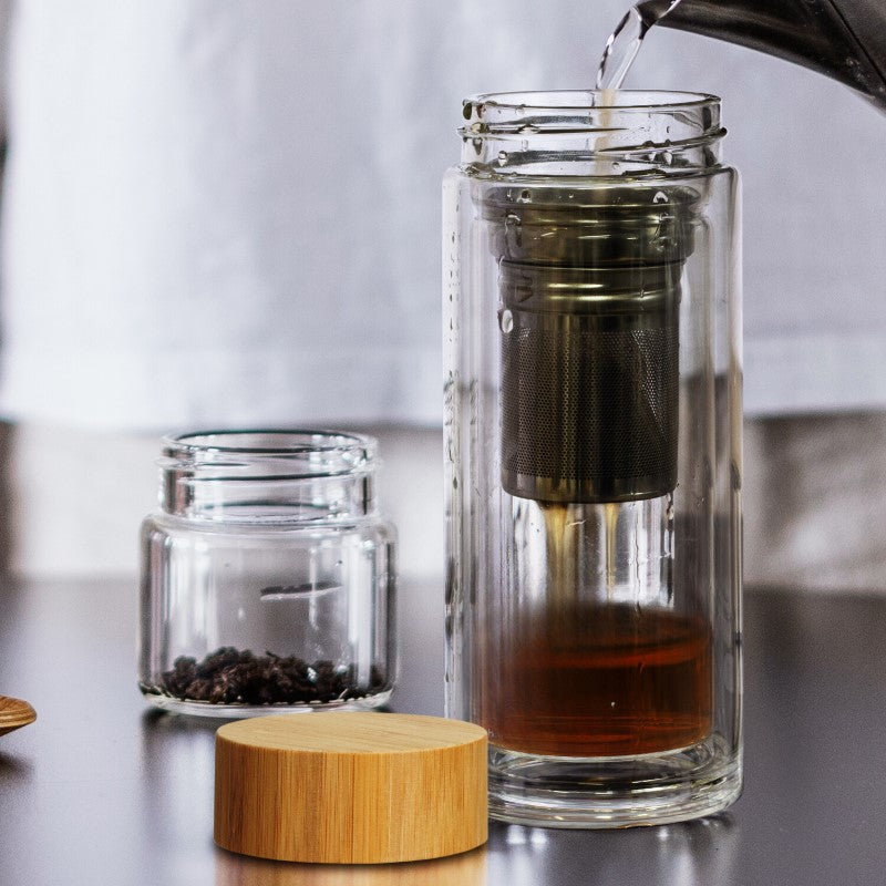 Elegant 350ml Tea Infusion Bottle in double-wall borosilicate glass with stainless steel infuser and bamboo lid for spill-free sipping.