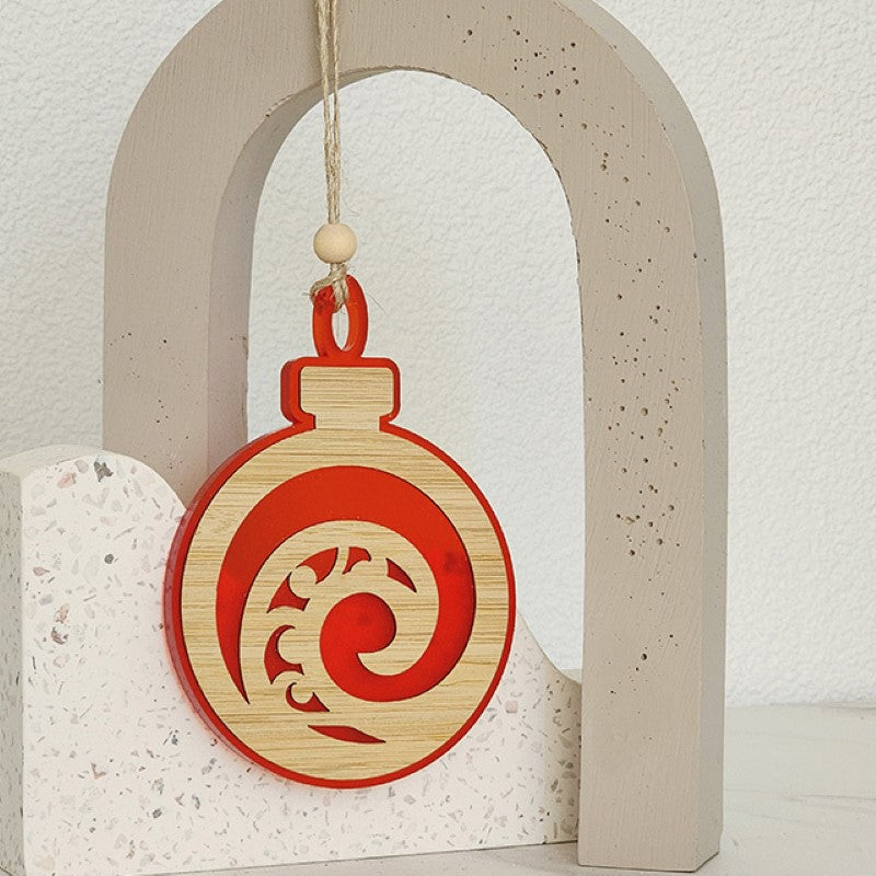 Acrylic Koru bauble symbolizing growth and harmony, perfect for Christmas or year-round decor, crafted for lasting beauty.