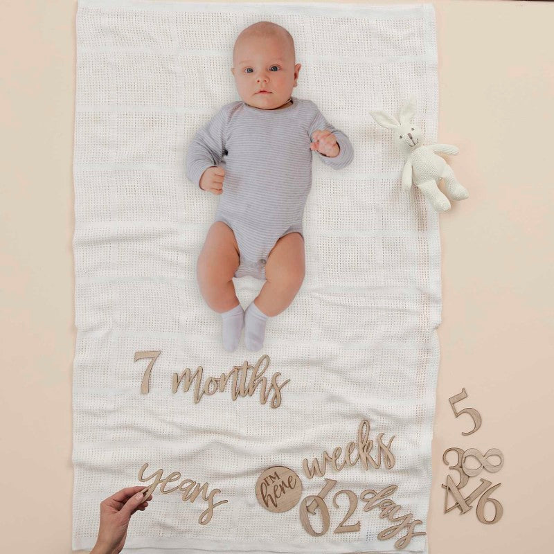 Wooden milestone signs kit for babies featuring 17 pieces to capture pregnancy and first-year growth moments.
