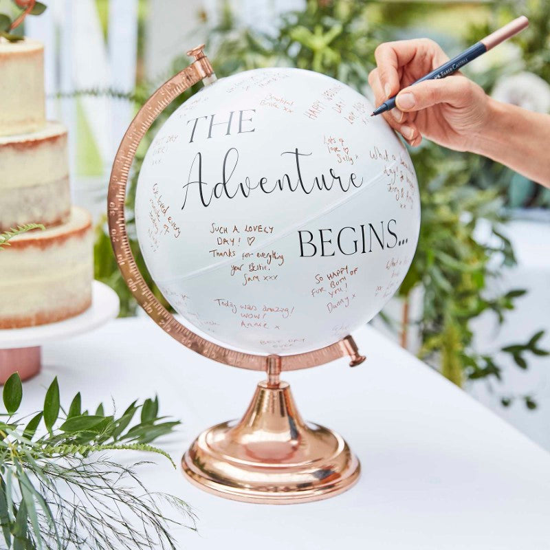 Elegant globe guest book for weddings, allowing guests to leave heartfelt messages in a unique and decorative way.