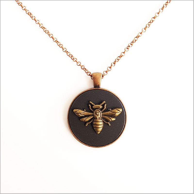Vintage Honey Bee Pendant in black acrylic with antique copper finish, 30mm diameter, 75cm chain, elegant nature-inspired design.