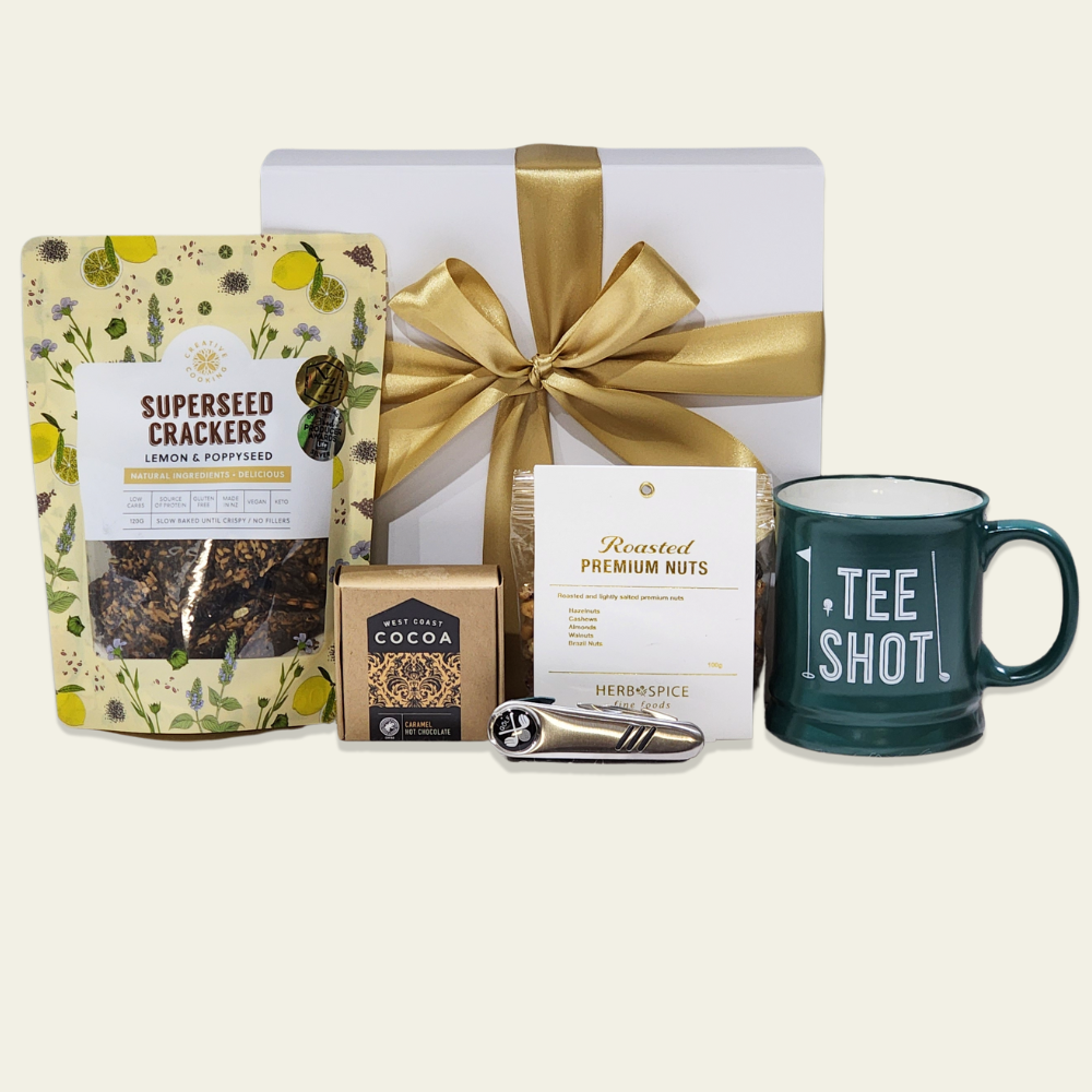 Golf Lover's Gourmet Gift Box featuring a ceramic mug, tool, snacks, and luxurious hot chocolate, perfect for golf enthusiasts.