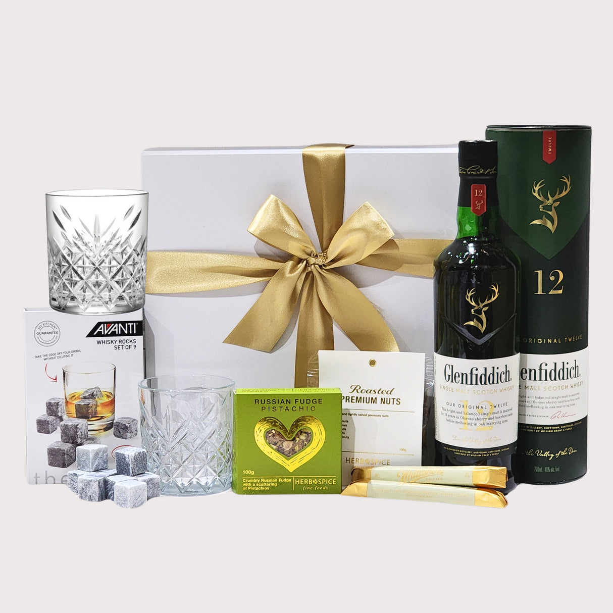 Timeless Whiskey Glenfiddich gift box featuring 12YO single malt, elegant glassware, and gourmet treats for connoisseurs.