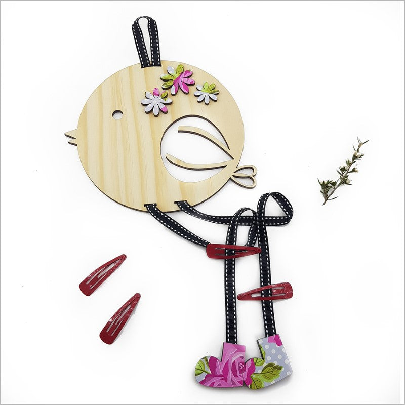 Adorable eco-friendly hair clip tidy made from pine veneer, perfect for organizing hair accessories in a child's room.