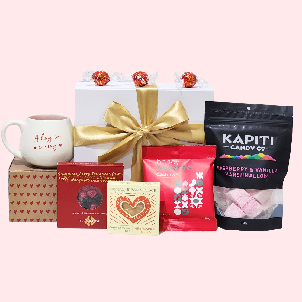 A beautifully presented Hugs & Kisses Gift Box with cozy items and sweet treats for expressing love and affection.