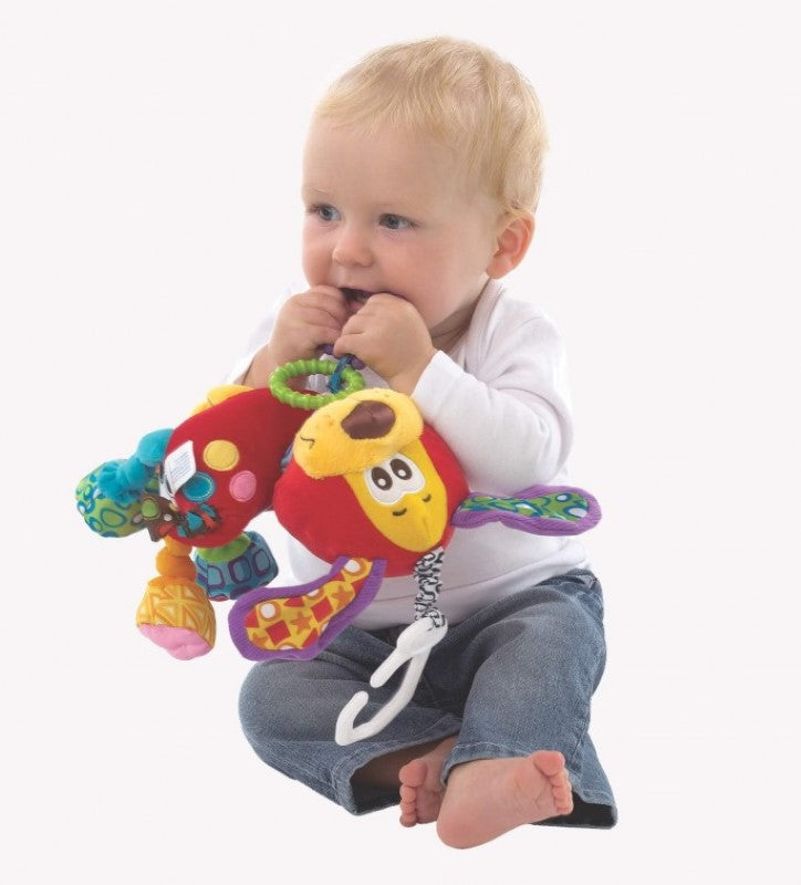 Colorful Pookie Puppy activity toy with textured rings, crinkle sounds, and rattles for sensory development on-the-go.