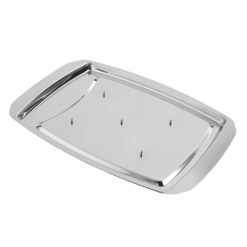 Carving tray with spikes in polished stainless steel, designed for effortless carving and juice collection.