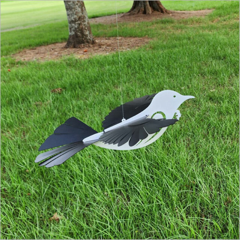 Majestic Large Flying Tui decoration in white acrylic, perfect for indoor/outdoor display, with hanging line included.