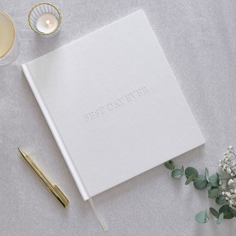 White embossed wedding album with 'Best Day Ever', 32 pages for guest messages and fun photos. Perfect for memories.