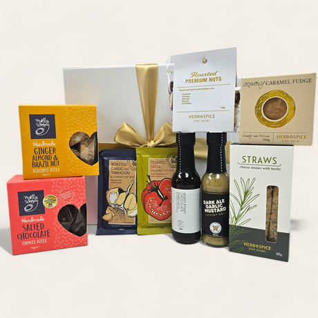 Gourmet gift box filled with sauces, nuts, biscuits, and dips for food lovers; beautifully packaged with a ribbon.